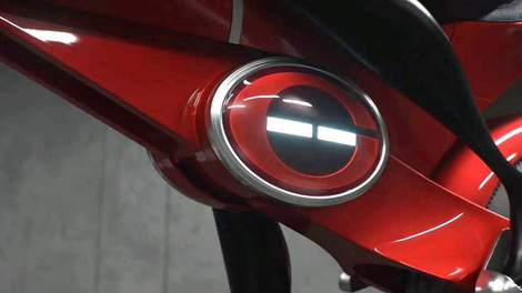 The light-stripe changes colors based on charge. This is also where the electromagnetic clamp holding the bike together is located.
